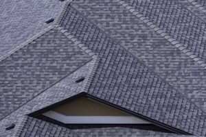 Large black and grey asphalt shingle roof on house