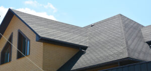 Close-up of a roof and gutter installation on a suburban home