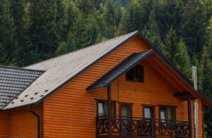Wooden home with a dark roof